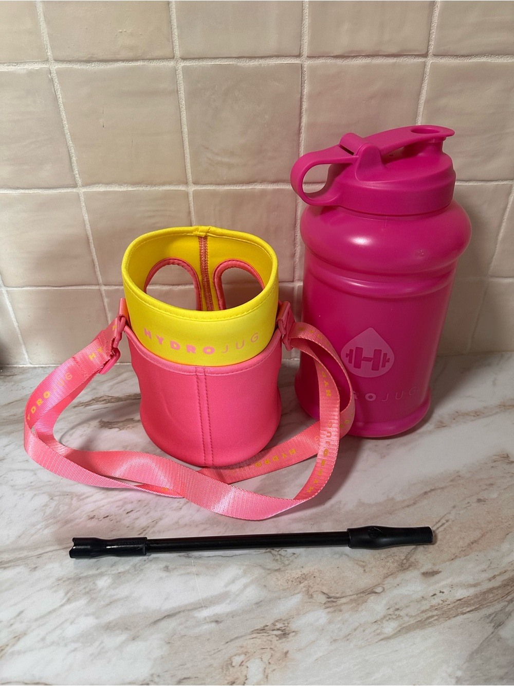 HydroJug pink and yellow water bottle bundle.